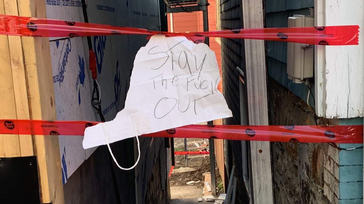 Gomez says she recently found this note taped to the entrance she uses to access her unit.