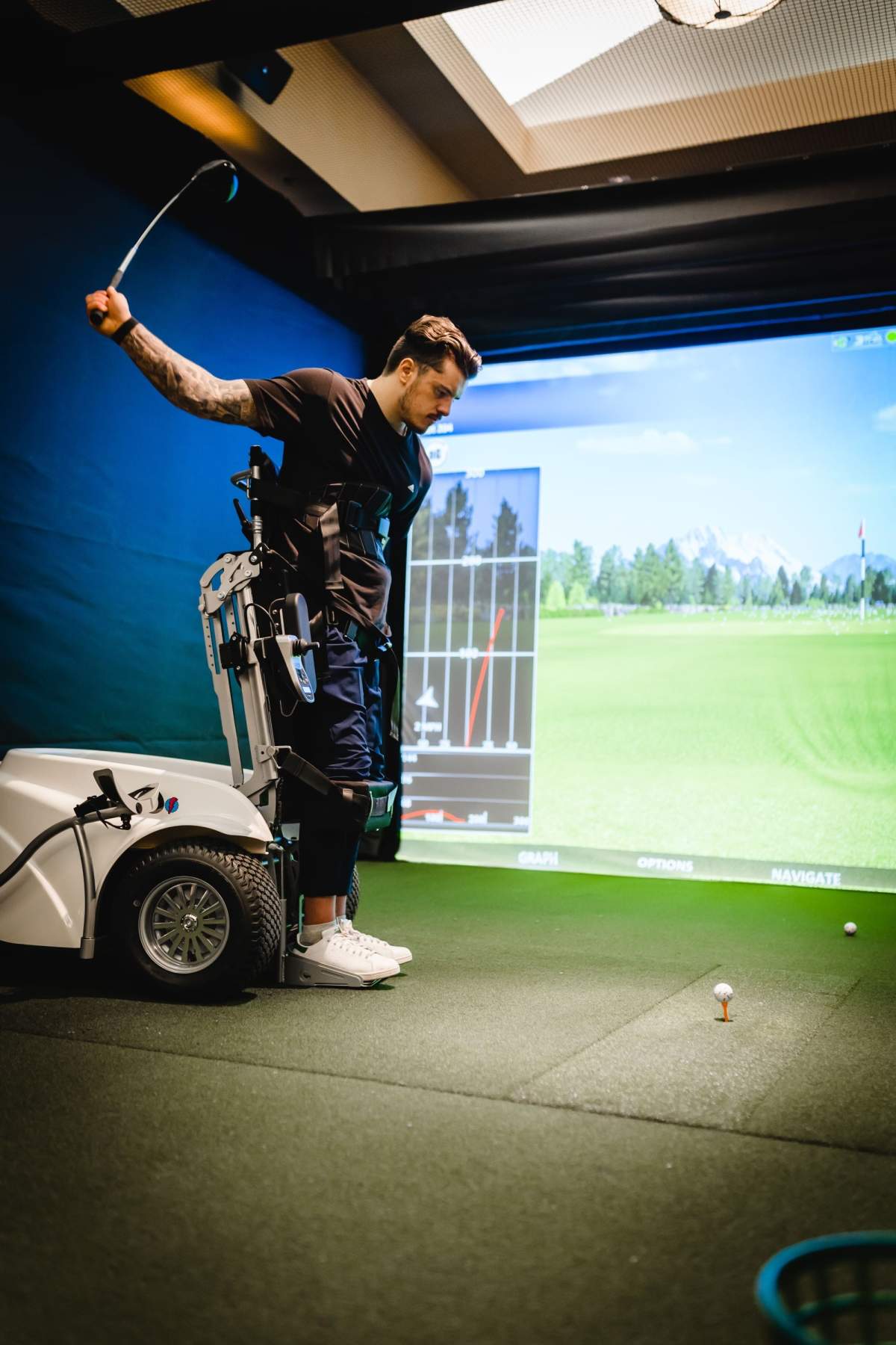 Ryan Straschnitzki demonstrates how to use a paragolfer device at Heritage Pointe Golf Club.