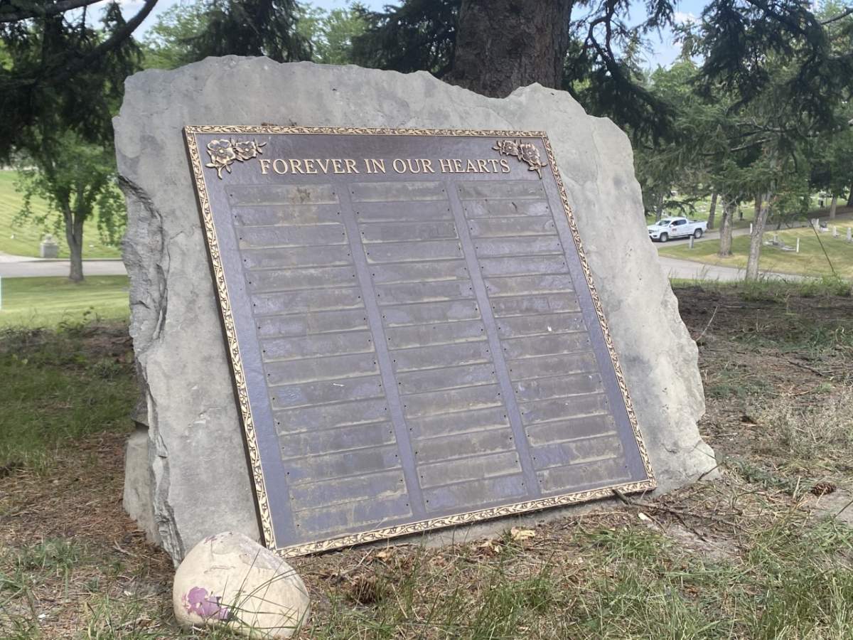 Memorial plaques are shown missing from a Calgary cemetery, on Aug. 26, 2022.
