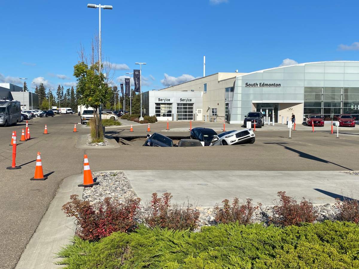 Sinkhole in the parking lot of Infiniti South Edmonton on Sept. 20, 2022.