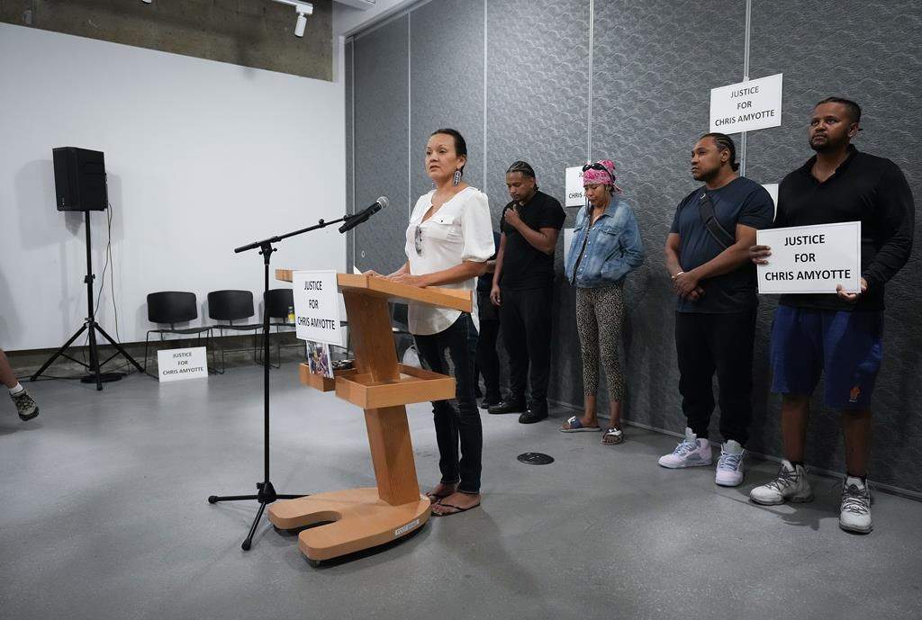 Chris Amyotte's cousin, Samantha Wilson, delivers a statement in front of (from left) Amyotte's brother Isaac Ndlovu, wife Amanda Cook, and brothers Michael Ndlovu and Richard Ndlovu during a news conference in Vancouver, B.C., Thursday, Sept. 1, 2022. Amyotte, an Ojibway man from Manitoba, died after he was shot by Vancouver police with a beanbag gun in the Downtown Eastside last month. 