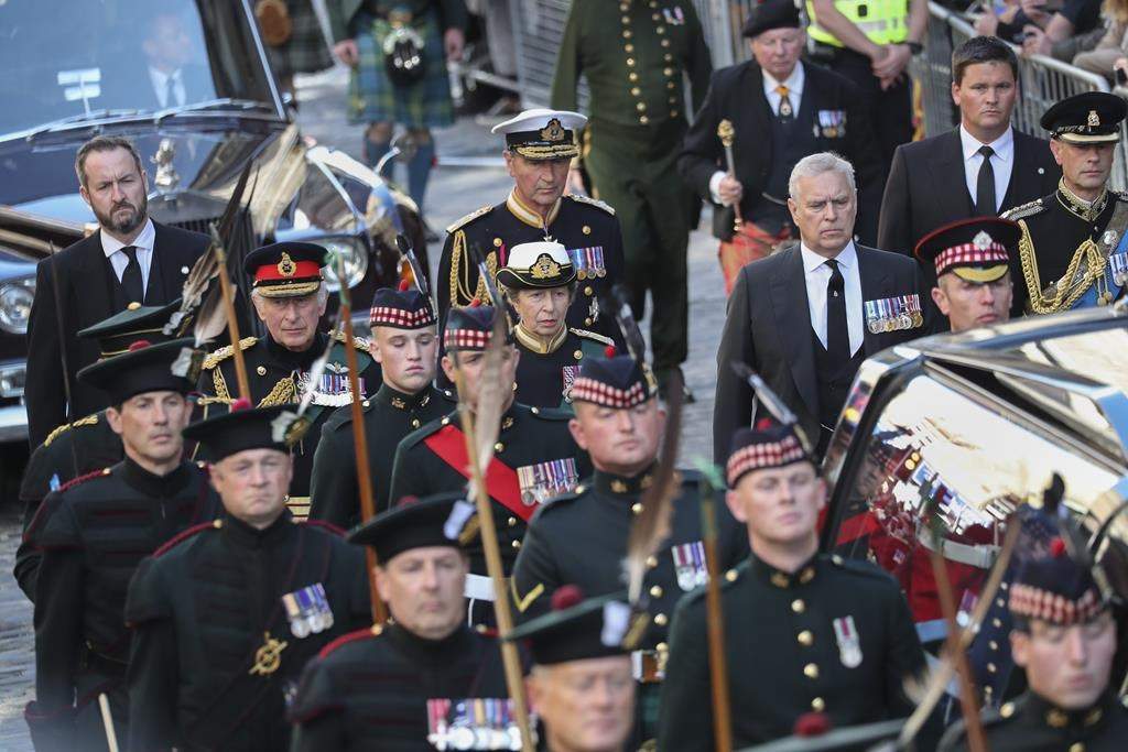 The procession with the coffin of Queen Elizabeth II, followed by, from left, King Charles III, Princess Anne, Prince Andrew, and Prince Edward, heads up the Royal Mile to St Giles' Cathedral in Edinburgh, Monday, Sept. 12, 2022. Britain's longest-reigning monarch who was a rock of stability across much of a turbulent century, died Thursday Sept. 8, 2022, after 70 years on the throne. She was 96.
