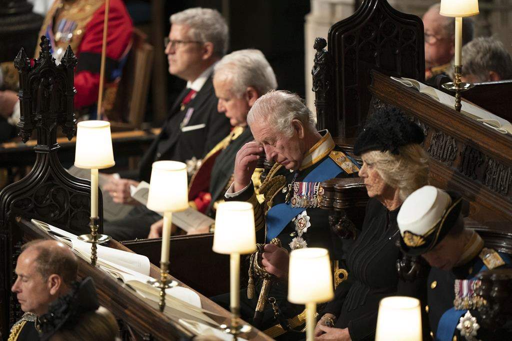 King Charles III, center, attend the committal service for Britain’s Queen Elizabeth II at St George’s Chapel, Windsor Castle, in Windsor, England, Monday, Sept. 19, 2022.