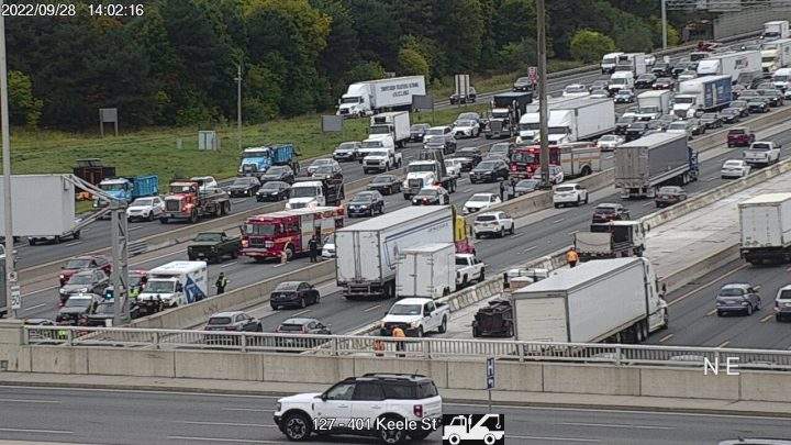 Emergency crews block lanes on Highway 401 at Keele Street on Wednesday.