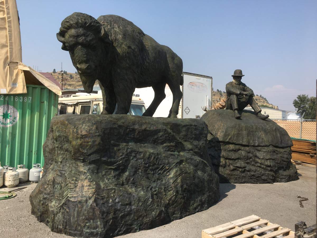 The Buffalo and the Buffalo Fur Trader by artist Kenneth Lum are two, 13-foot-tall bronze sculptures commissioned for the Walterdale Bridge replacement in Edmonton, Alta.