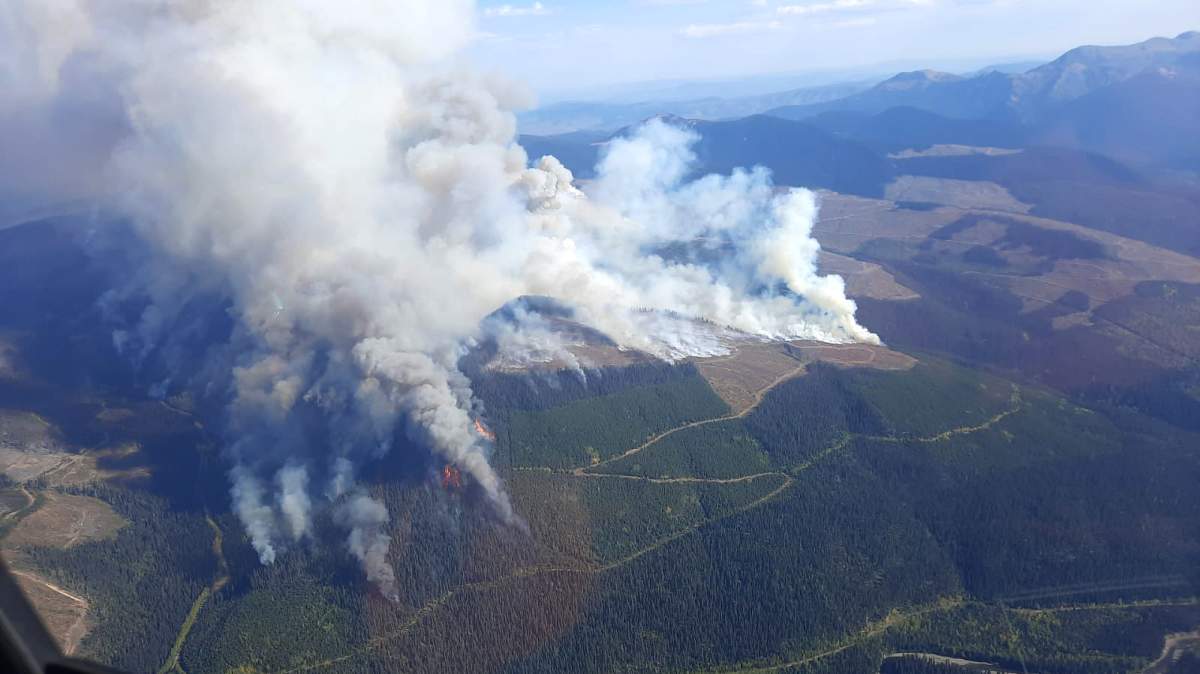 Smoke rises from the Battleship Mountain wildfire on Sept. 15, 2022.