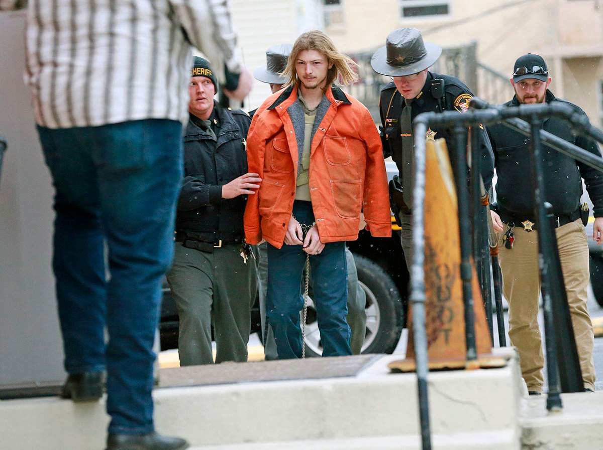 This Tuesday, Nov. 27, 2018 file photo shows Edward "Jake" Wagner being escorted by police into the holding area in the Pike County Common Pleas Court in Waverly, Ohio.