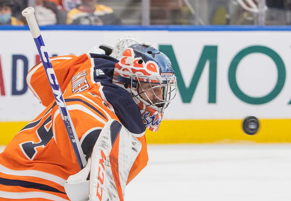 Edmonton Oilers goaltender Stuart Skinner (74) makes a save during third period NHL hockey action against the Boston Bruins in Edmonton, Alta., on Thursday December 9, 2021.