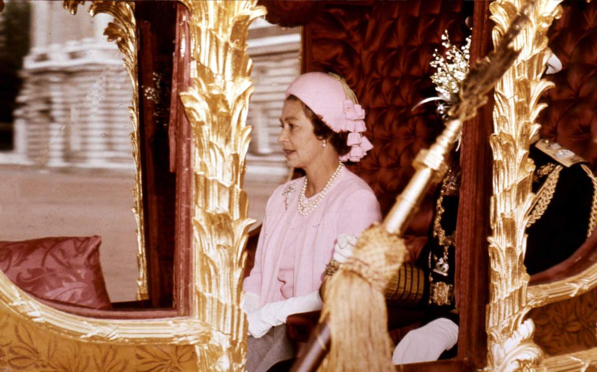 Queen Elizabeth II is shown in a carriage on the way to a ceremony for her Silver Jubilee at St Paul's Cathedral in 1977.