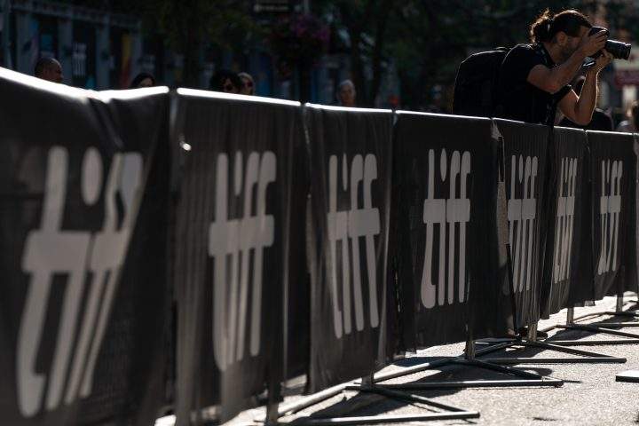 A photographer takes a photo at the Toronto International Film Festival's kick off event in Toronto on Thursday, September 8, 2022.