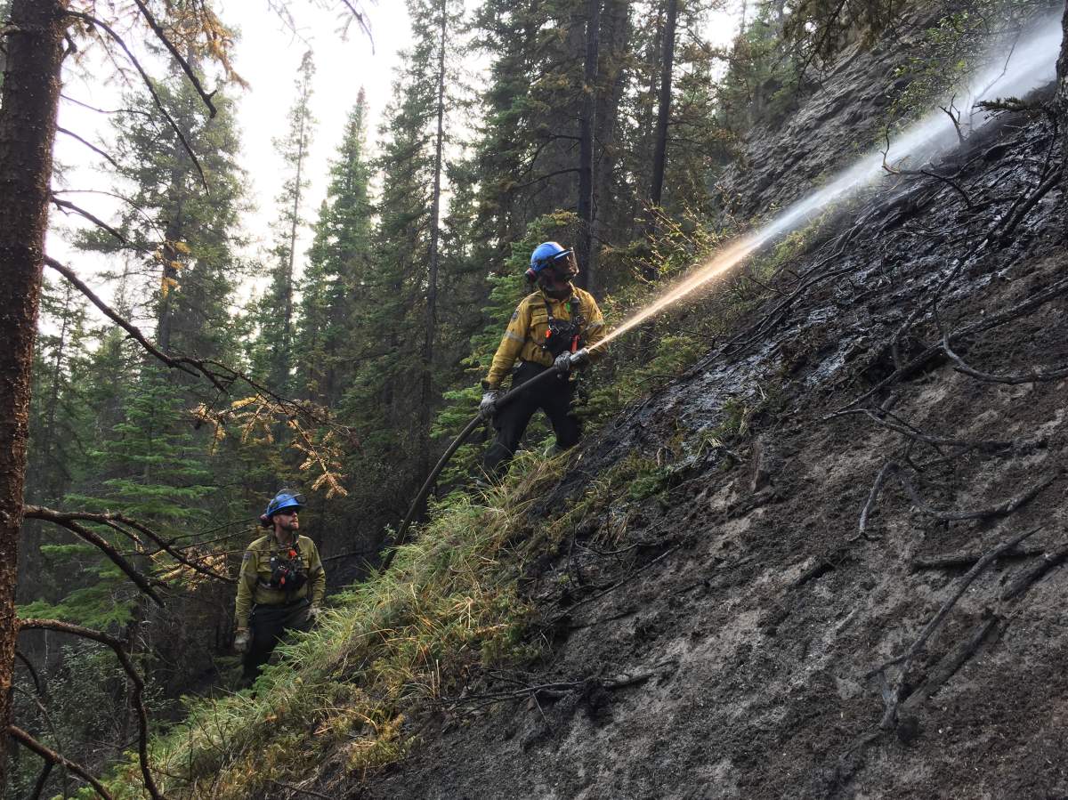 File photo of firefighters work on the Chetamon wildfire in Jasper National Park Sept. 18, 2022.