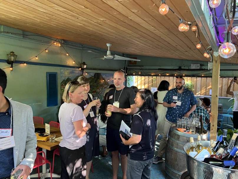 Coryn Kempster chats with new acquaintances at a Husmates mixer