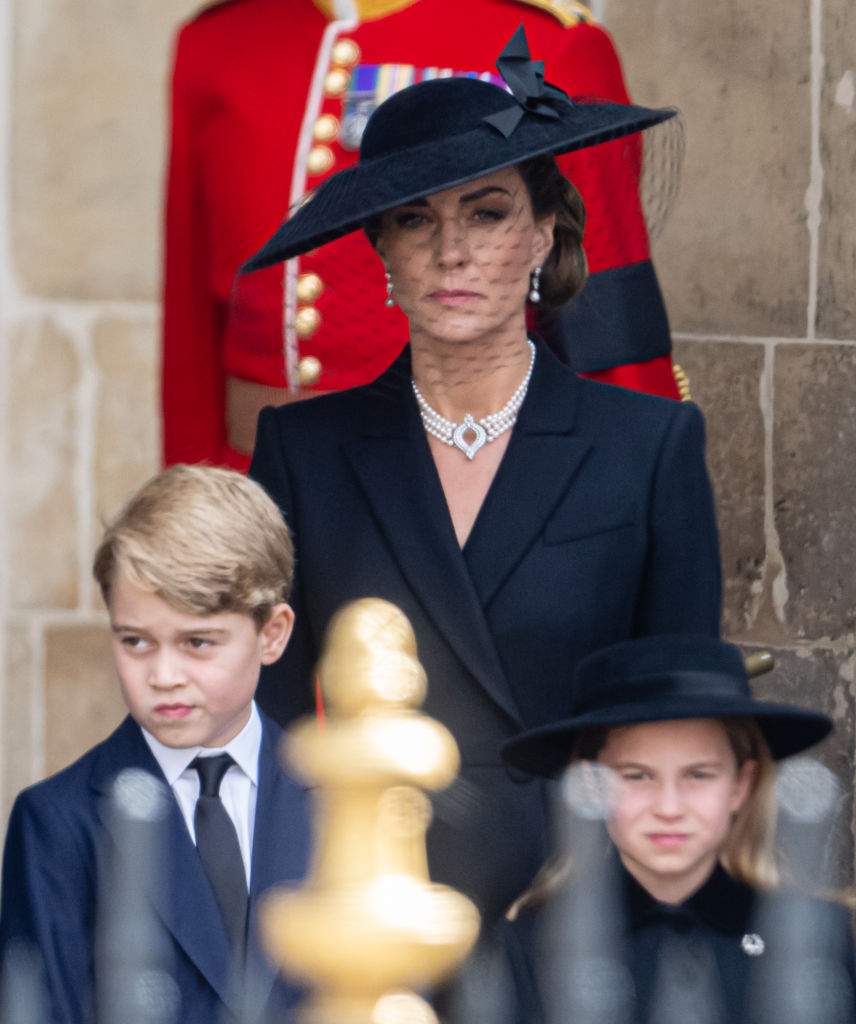Prince George of Wales, Catherine, Princess of Wales, Princess Charlotte of Wales during the State Funeral of Queen Elizabeth II at Westminster Abbey on September 19, 2022 in London, England.