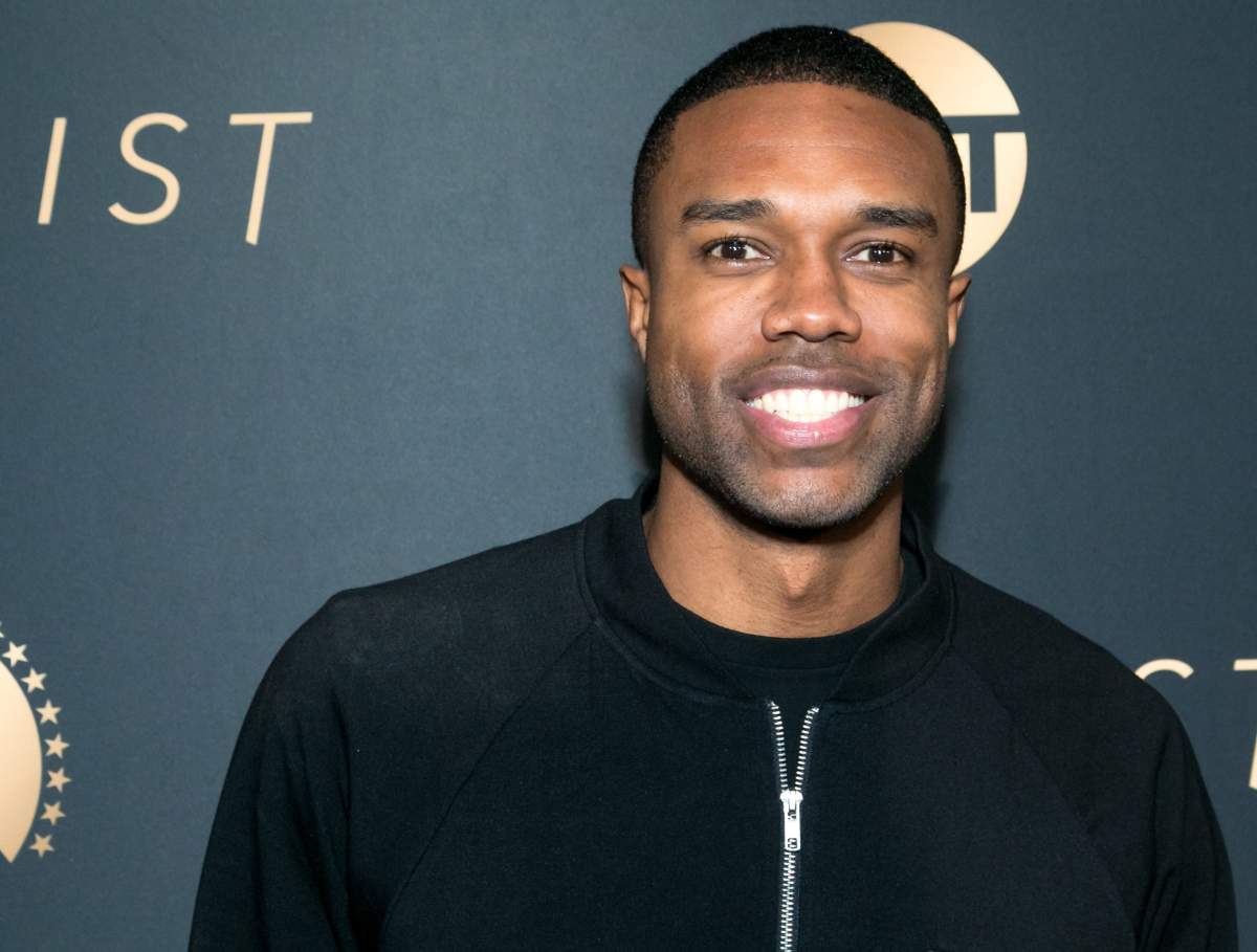 DeMario Jackson on a red carpet in a black jacket.