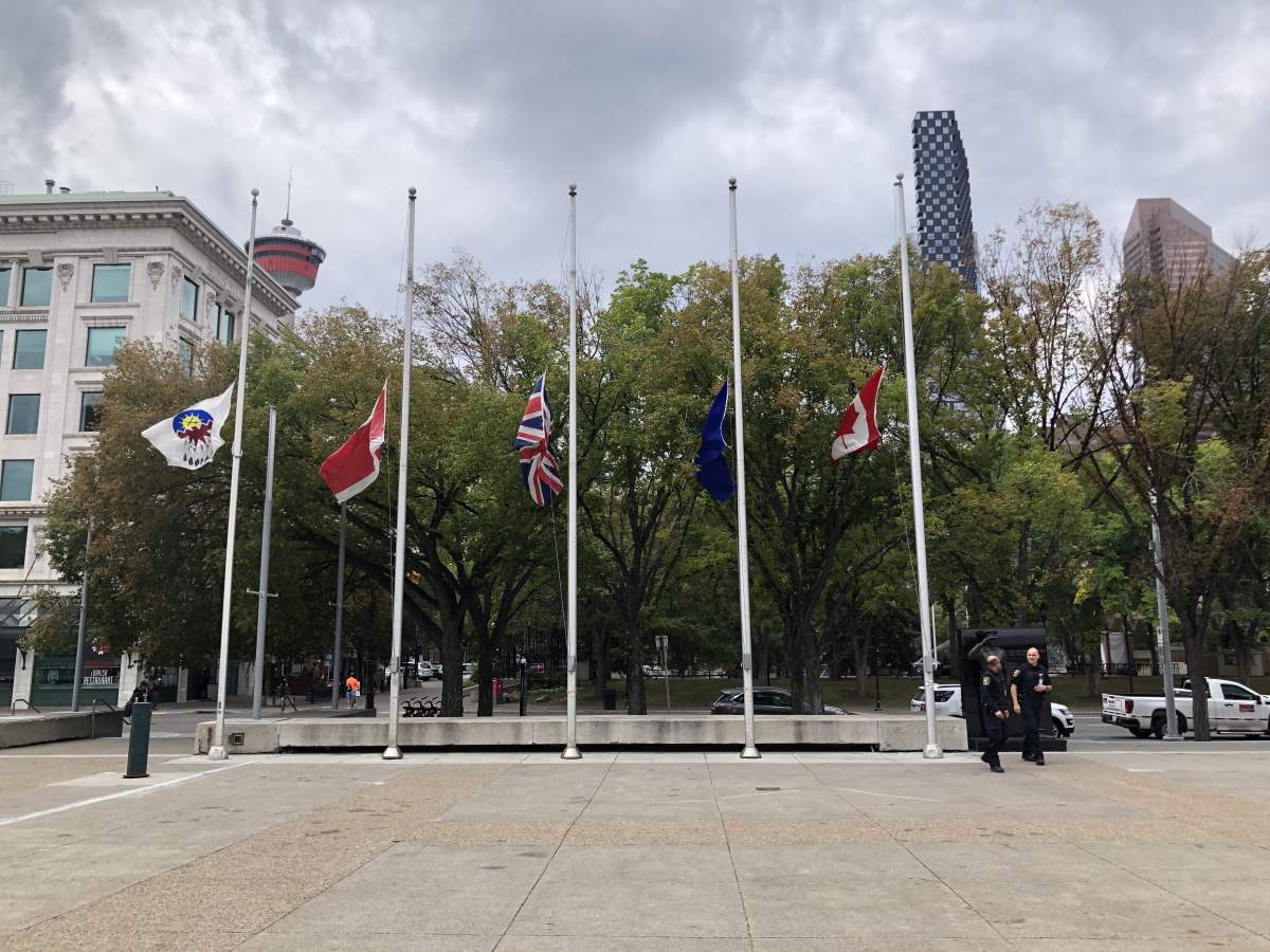 Flags at half mast at city hall in Calgary, Alta. on Sept. 8, 2022 after Queen Elizabeth II died.