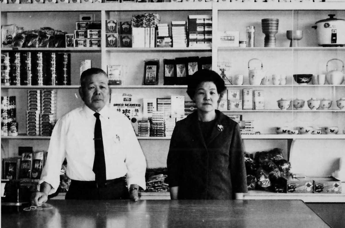 Ryutaro and Nobuko behind the counter of their store.