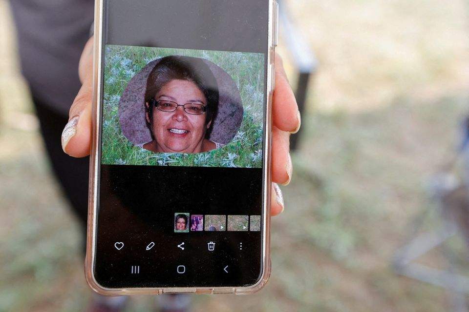 A person holds a phone showing a photo of Gloria Lydia Burns, 62, who was killed on James Smith Cree Nation after a stabbing spree killed 10 people on the reserve and nearby town of Weldon, Saskatchewan, Canada. September 5, 2022
