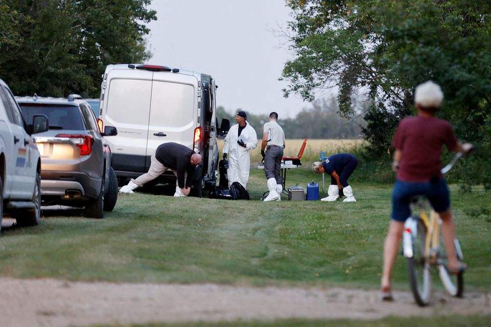 A police forensics team investigates a crime scene after multiple people were killed and injured in a stabbing spree in Weldon, Saskatchewan, Canada. September 4, 2022.