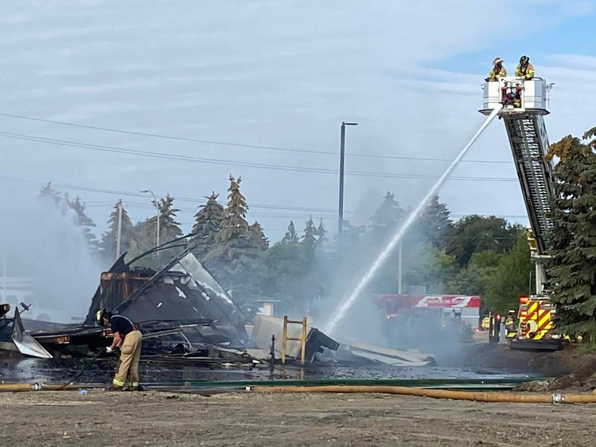 Fire crews battle blaze at a building in the area of 95 Avenue and 49 Street Monday, Sept. 12, 2022.