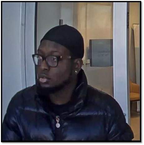Police say this man is a suspect in a romance scam that saw a woman defrauded of more than $70,000.