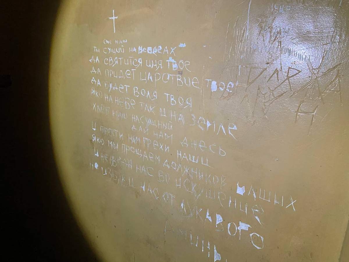Prayer etched on the wall of a cell where torture victims were held, Balakliya, Ukraine.
