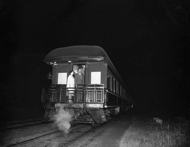 The Royal couple take a last look at Calgary as they board the Royal train at Turner Siding for the trip to Banff, Lake Louise and the west coast. Published in Calgary Herald July 10, 1959.
