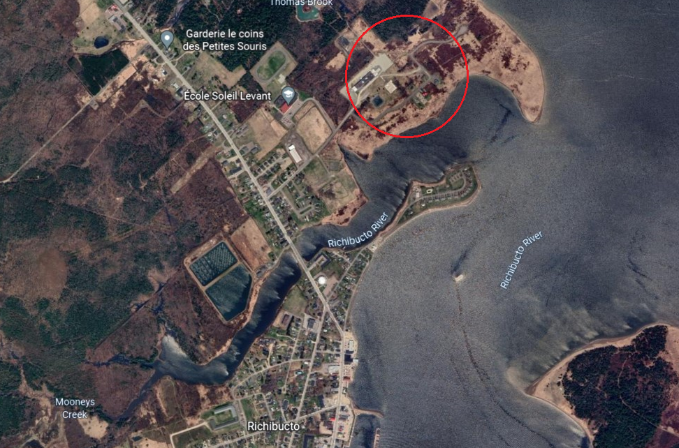 A Google Earth rendering shows the town of Richibucto. The red circle indicated the approximate location of what is now Coastal Shell Products, located less than a kilometre from an elementary school.