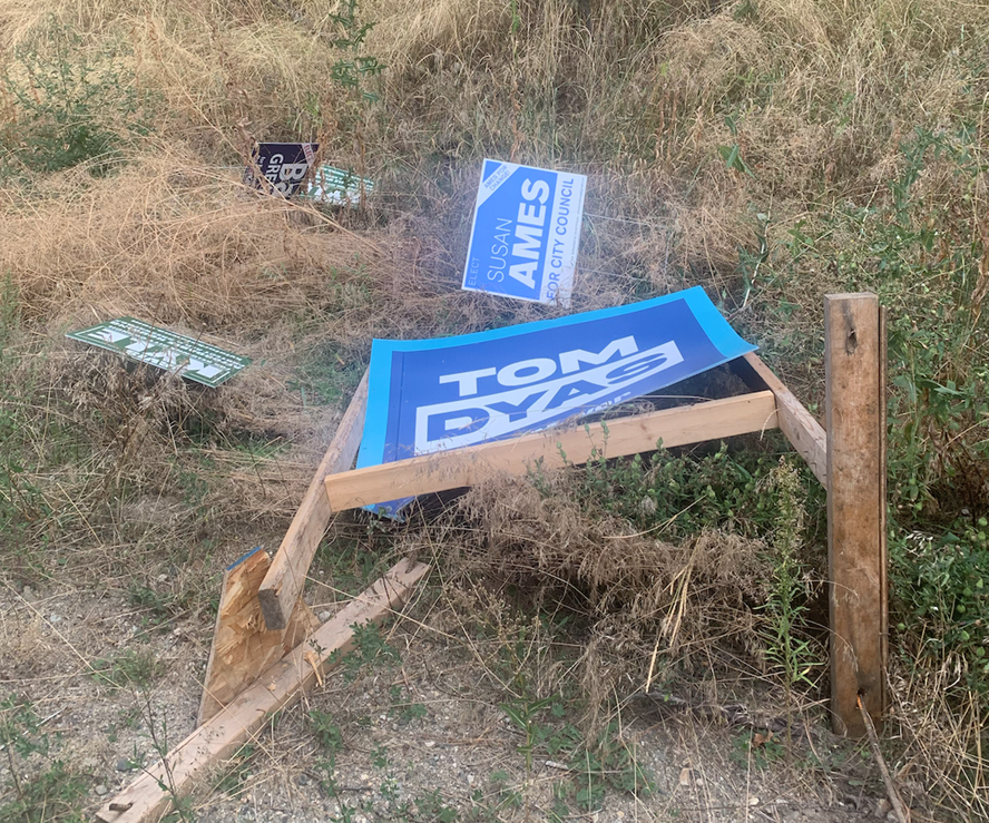 A destroyed campaign sign for Kelowna Mayoral candidate Tom Dyas.