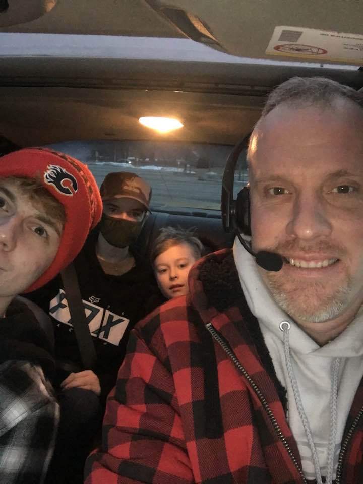 Tom on a road trip with the boys he mentors.