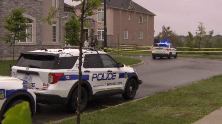 Peel police officers at the scene of a fatal shooting in Brampton Monday morning.