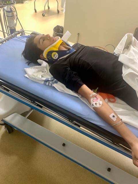 Saiva in a neck brace at Alberta Children’s Hospital.