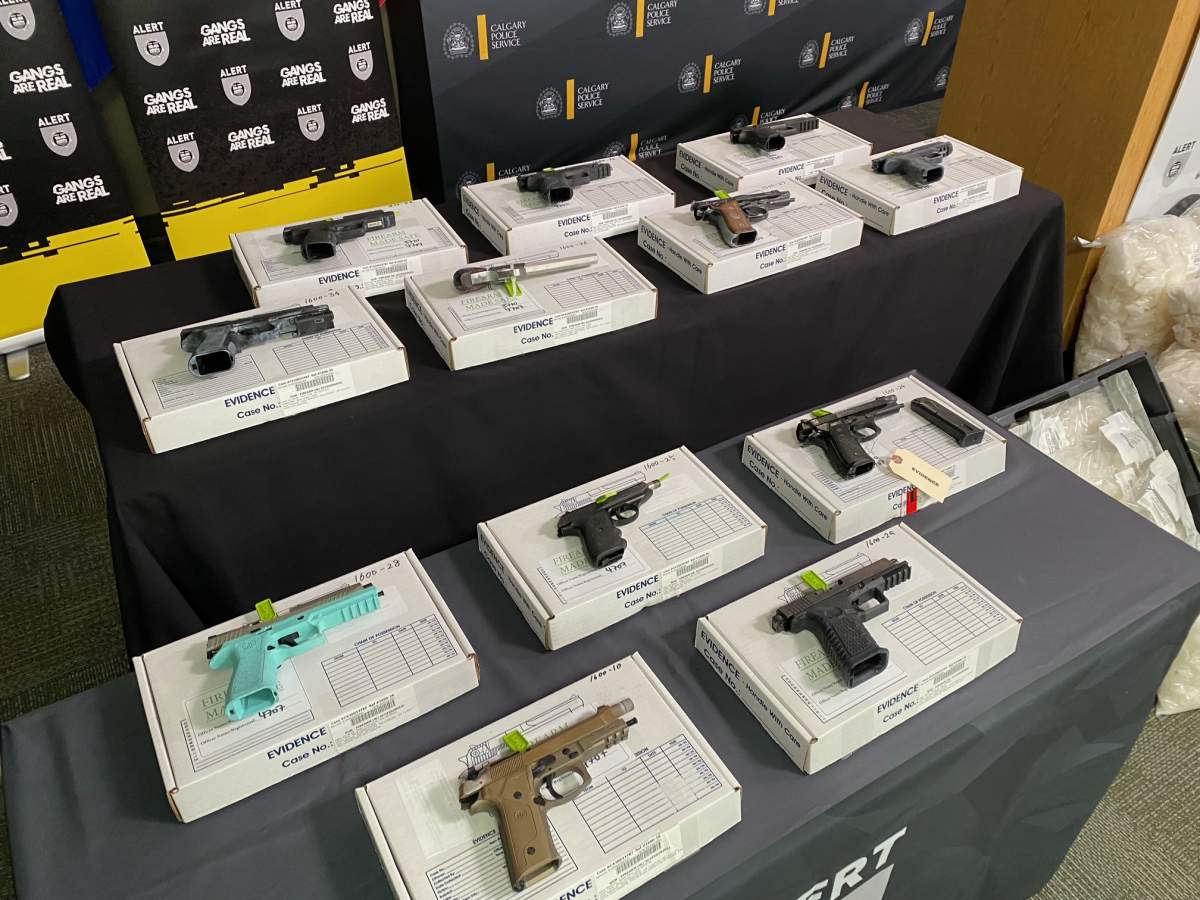 A total of 19 firearms including handguns, rifles, submachine guns and suppressors were taken off the street as a result of Project Cobra and were shown at a news conference on Sept. 28, 2022.
