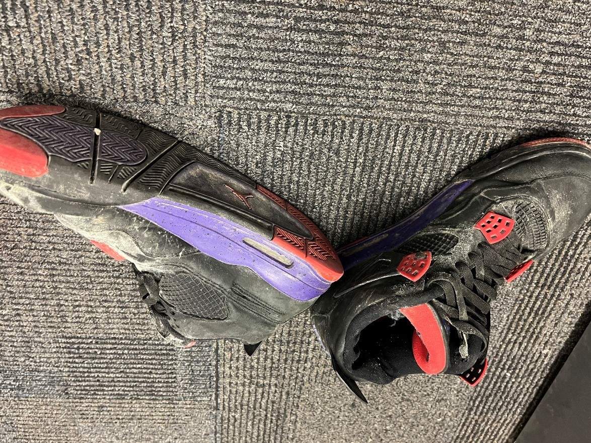 The man’s shoes.