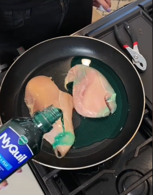 Raw chicken in a man with NyQuil being poured overtop from a bottle.