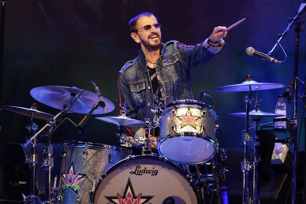 FILE - Ringo Starr plays as part of a concert celebrating the 50th anniversary of Woodstock in Bethel, N.Y., Friday, Aug. 16, 2019.