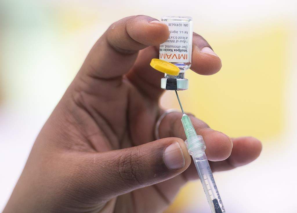 A health-care worker prepares monkeypox vaccine in Montreal on July 23, 2022. Second doses of the monkeypox vaccine will be available to British Columbians starting this week. THE CANADIAN PRESS/Graham Hughes.