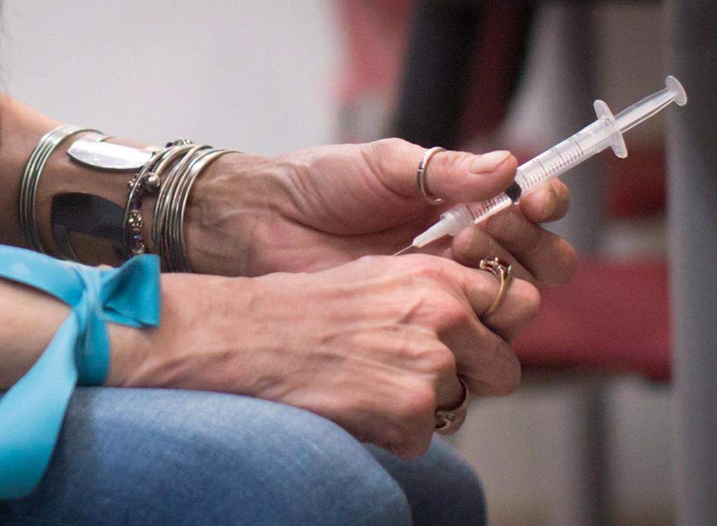 A person injects hydromorphone.