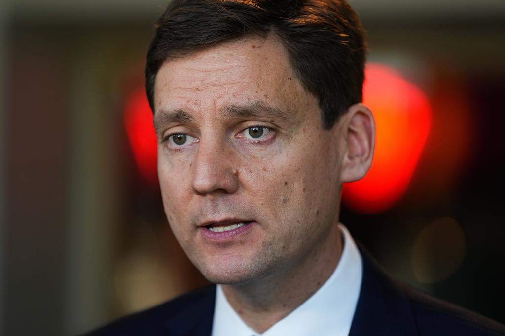 B.C. NDP leadership candidate David Eby responds to questions while speaking with reporters in Vancouver, B.C., Wednesday, Oct. 19, 2022.