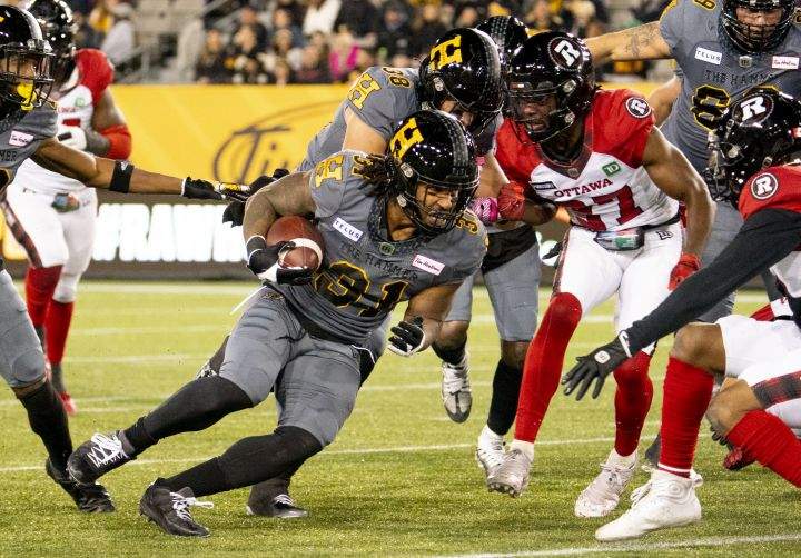 Hamilton Tiger-Cats running back Sean Thomas Erlington (31) carries the ball during first half CFL football game action against the Ottawa Redblacks in Hamilton, Ont. on Friday, October 21, 2022.