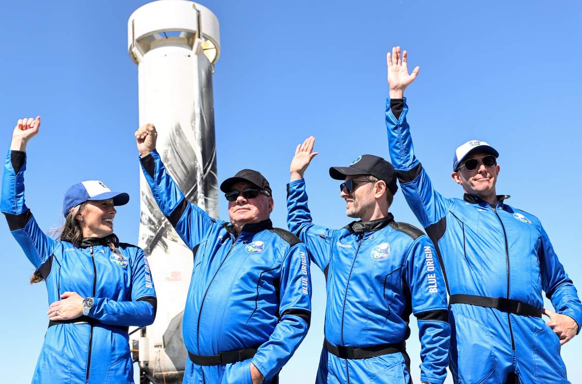 Blue Origin vice president of mission and flight operations Audrey Powers, Star Trek actor William Shatner, Planet Labs co-founder Chris Boshuizen and Medidata Solutions co-founder Glen de Vries wave at the press.