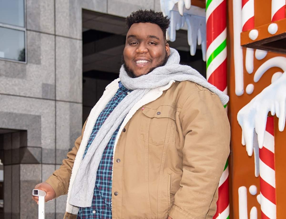 Willie Spence in a brown coat and grey scarf.