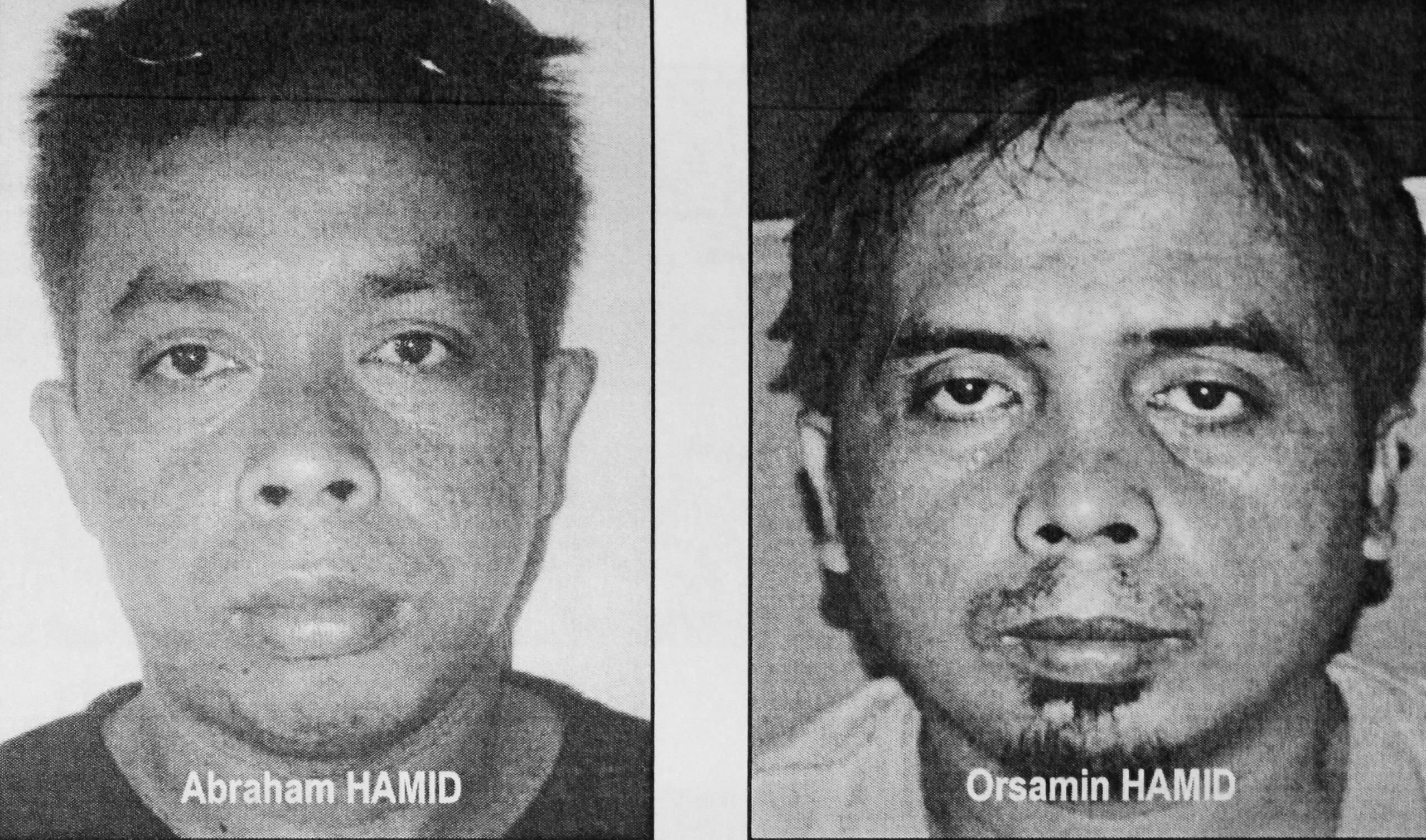 Alleged Abu Sayyaf members a witness said kidnapped a pair of Canadians and two others from Samal Island, Philippines, on Sept. 21, 2015.