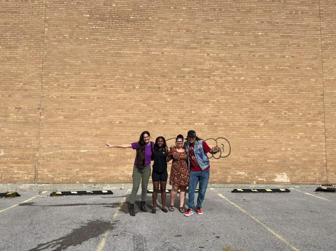 Artist Shalak Attack (Clandestinos) Shak’s World Owner Shanicka Edwards, Downtown Barrie BIA Communications and Public Realm Coordinator Sarah Jensen, and artist Bruno Smoky (Clandestinos) outside Shak’s World Community Centre on Maple Avenue.