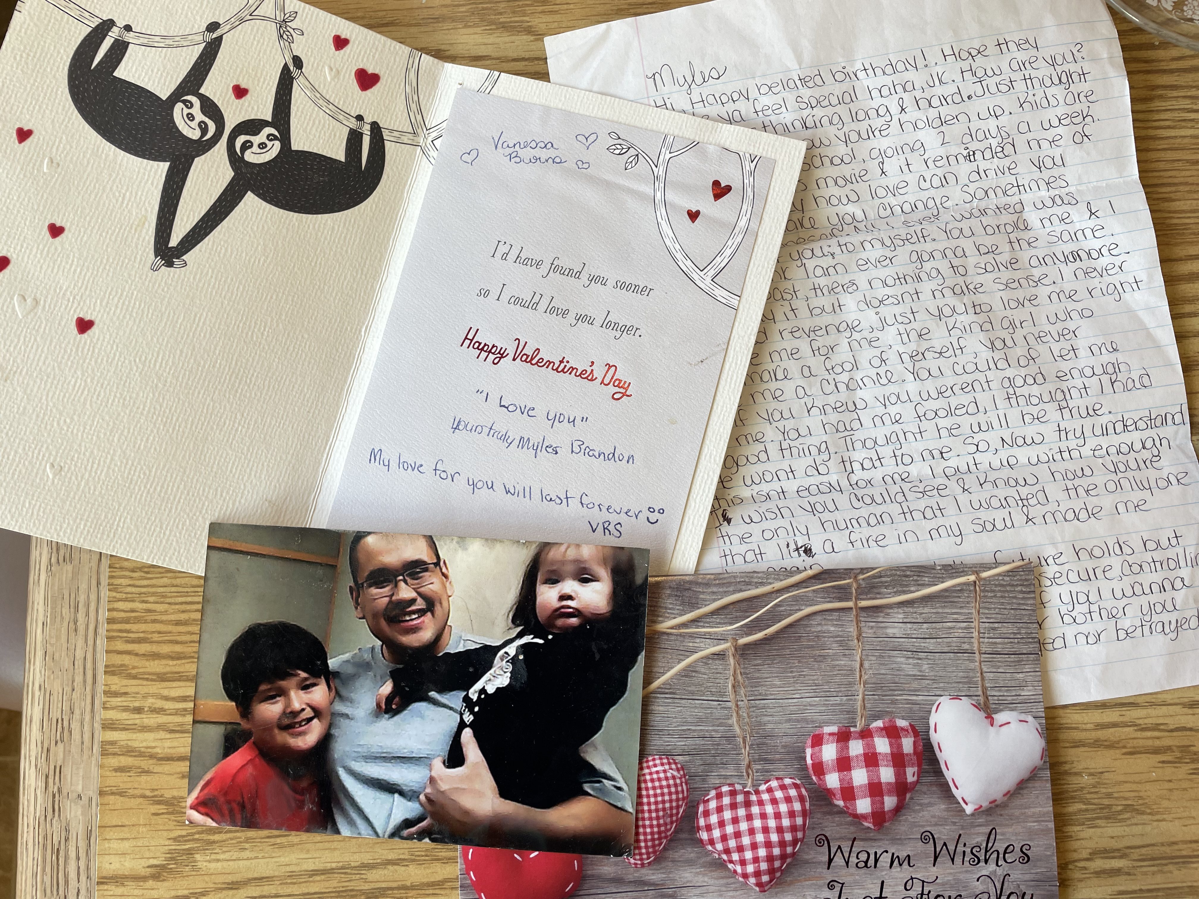 Valentine’s Day cards Sanderson wrote Burns from prison, along with a picture of him and his children and a letter Burns wrote him but never sent.