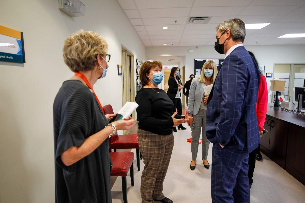 Premier Tim Houston speaks with Jackie Rodgers, nurse practitioner at Dalhousie family medicine.