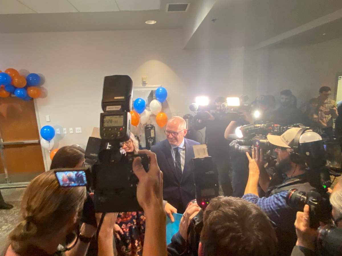 Scott Gillingham smiles for the cameras on election night.