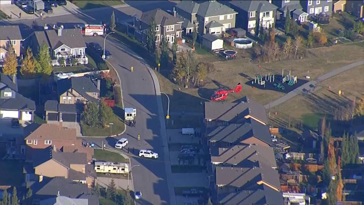Emergency responders are seen in a neighbourhood in Langdon, Alta., on October 7, 2022.