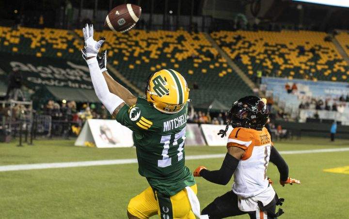 B.C. Lions' Garry Peters (1) chases Edmonton Elks' Dillon Mitchell (17) as he makes the catch for the touchdown during first half CFL action in Edmonton, Alta., on Friday October 21, 2022. 