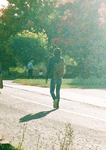 Guelph police want to speak to the man in the photo who was seen walking away from the scene of the stabbing.