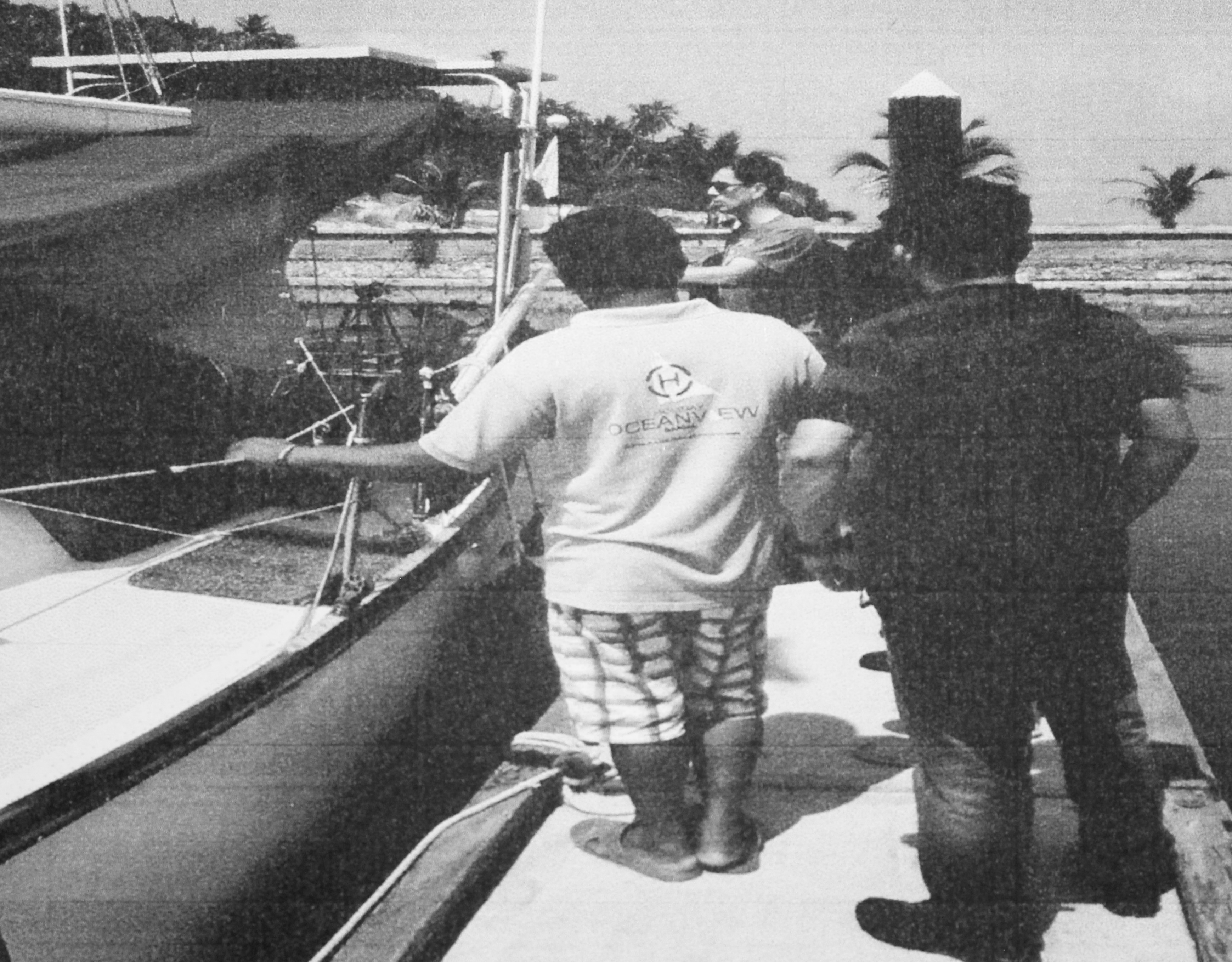 RCMP officer (in sunglasses) at site of kidnapping on Samal Island, Philippines, 2015.